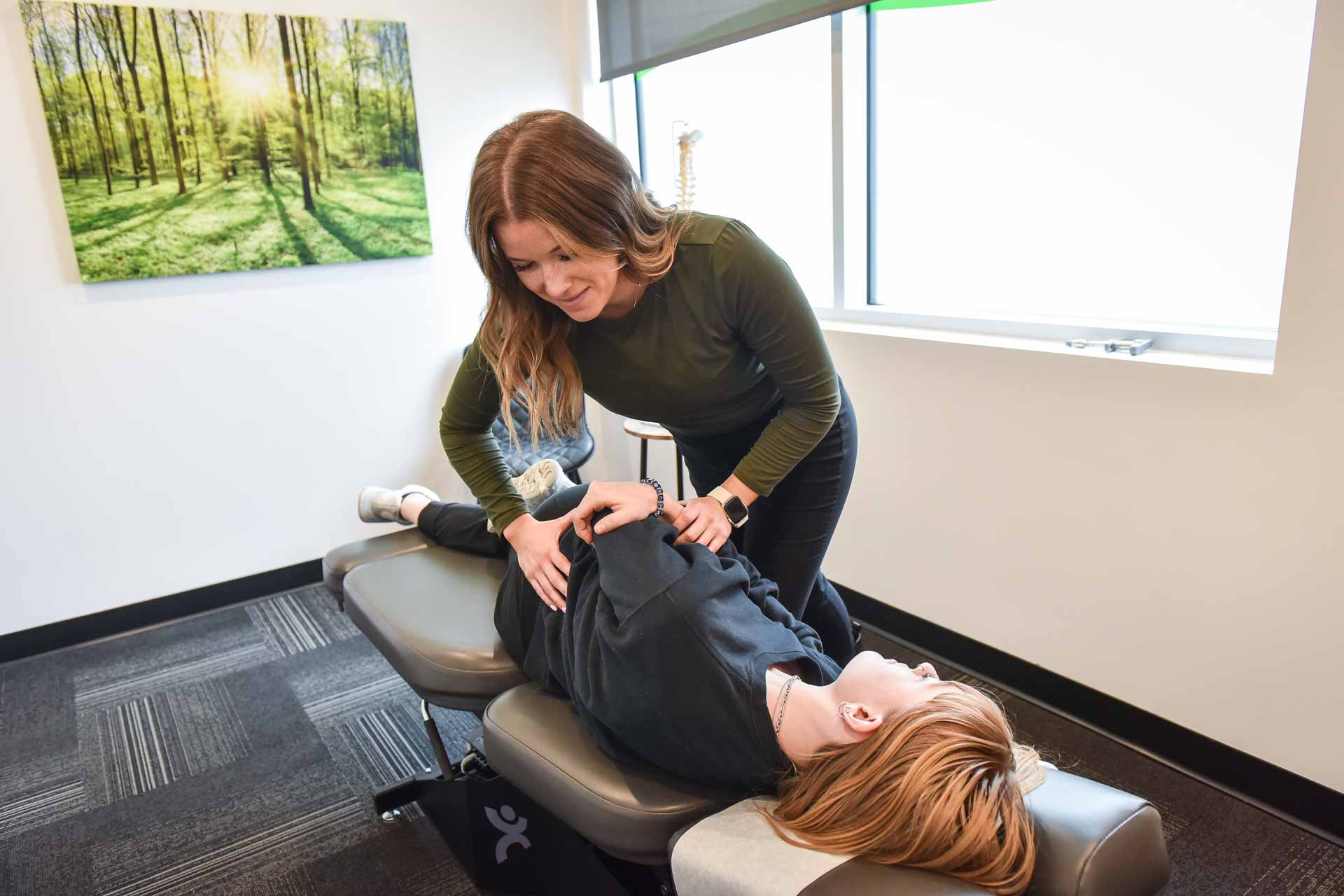 Dr. Jaycee George with Patient | Complete Health | Chiropractic & Wellness Center | Okotoks & SW Calgary